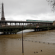 The swelling Seine River inches closer to a bridge in Paris. Photo: AP